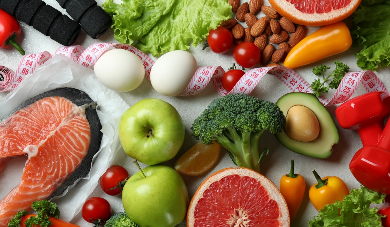 healthy food and red dumbbells on white table 2026 09 22 03 32 26 utc