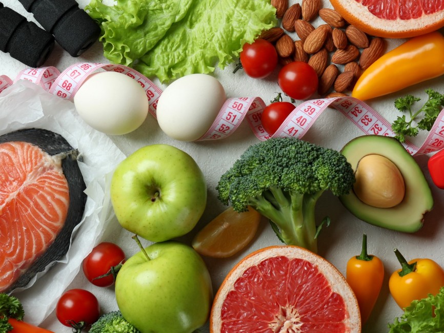 healthy food and red dumbbells on white table 2026 09 22 03 32 26 utc