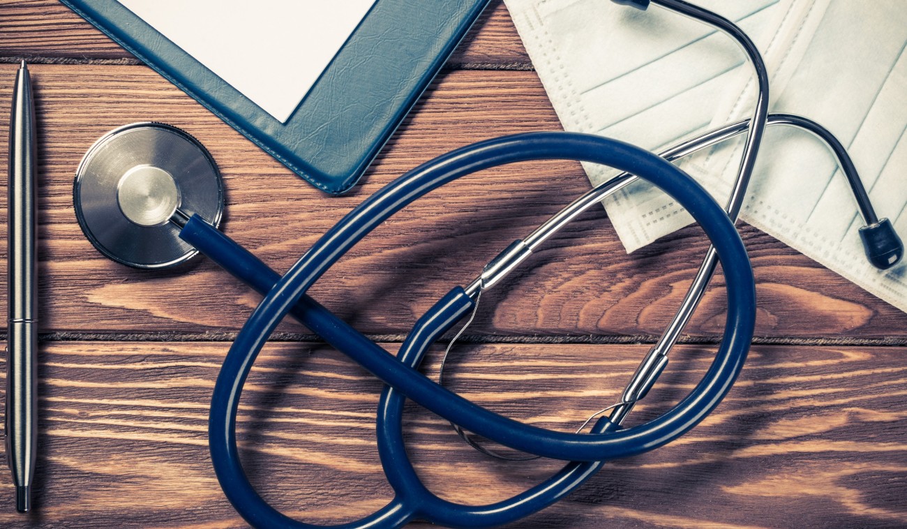 stethoscope and mask on a wooden desk 2026 09 22 14 41 33 utc